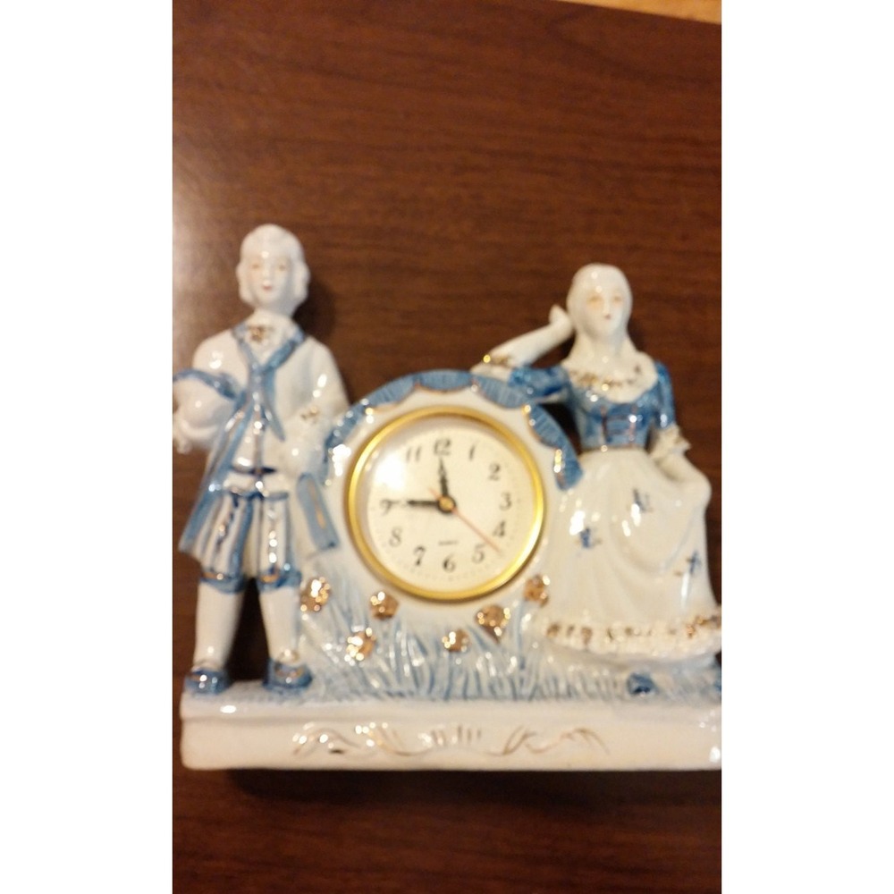 Clock, Porcelain courting couple Delft style statuette clock, blue and white